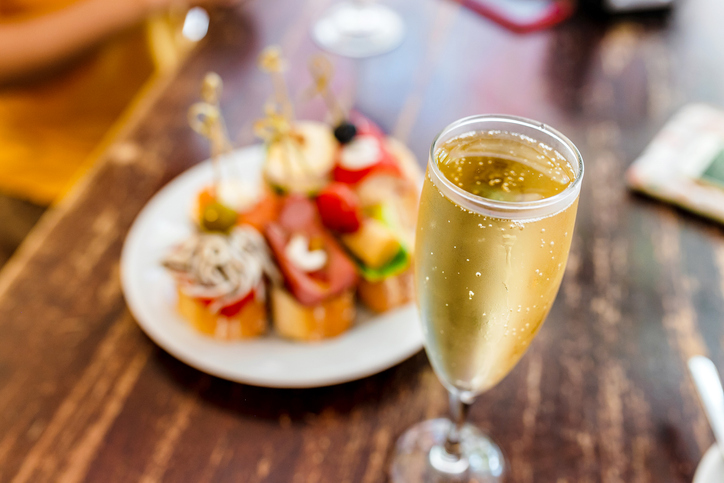 Cava wine with a plate of food